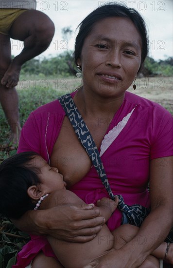 COLOMBIA, North West Amazon, Tukano Indigenous People, Makuna mother breastfeeding baby. Tukano  Makuna Indian North Western Amazonia family American Babies Colombian Columbia Hispanic Indegent Kids Latin America Latino Mum South America Tukano