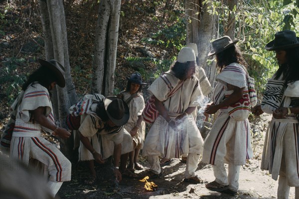 COLOMBIA, Sierra Nevada de Santa Marta, Ika, Ika Mortuary rites being performed in the rio Guatapuri valley for three Ika leaders murdered by right-wing paramilitaries linked to the Colombian Army. Arhuaco Aruaco indigenous tribe mourning funeral death American Colombia Hispanic Indegent Latin America Latino Religion South America  Arhuaco Aruaco indigenous tribe mourning funeral death American Columbia Hispanic Indegent Latin America Latino Religion South America 3 Religious