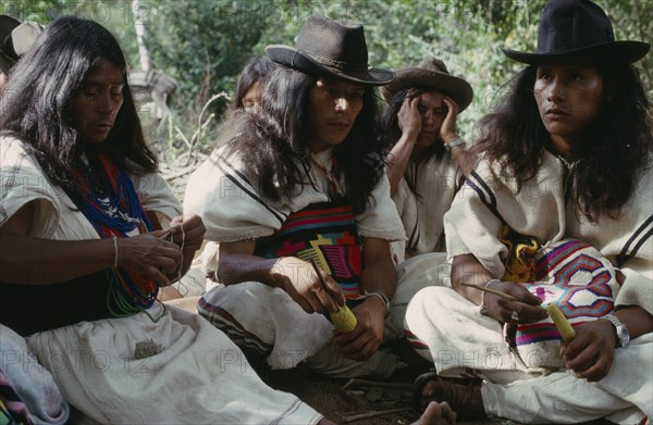 COLOMBIA, Sierra Nevada de Santa Marta, Ika, Ika widow and sons at mortuary rites being performed in Guatapuri valley for her husband  an Ika leader murdered by right-wing paramilitaries linked to the Colombian Army. Arhuaco Aruaco indigenous tribe mourning funeral death American Colombia Hispanic Indegent Latin America Latino Religion South America  Arhuaco Aruaco indigenous tribe mourning funeral death American Columbia Hispanic Indegent Latin America Latino Religion South America Religious