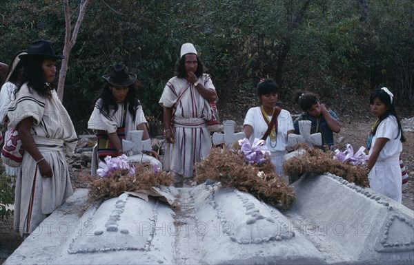 COLOMBIA, Sierra Nevada de Santa Marta, Ika, Sons and daughters of three Ika leaders murdered by paramilitaries linked to the Colombian army  beside the graves of their fathers. Arhuaco Aruaco indigenous tribe mourning funeral death American Colombia Hispanic Indegent Latin America Latino Religion South America Religious  Arhuaco Aruaco indigenous tribe mourning funeral death American Columbia Hispanic Indegent Latin America Latino Religion South America Religious 3