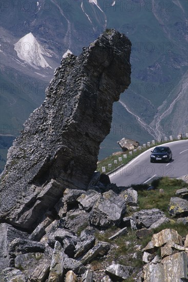 AUSTRIA, Hohe Tauern, High Tauern N. Park, Witches Kitchen rock formation above car on Grossglockner Road in mountain range forming part of the Eastern Alps.