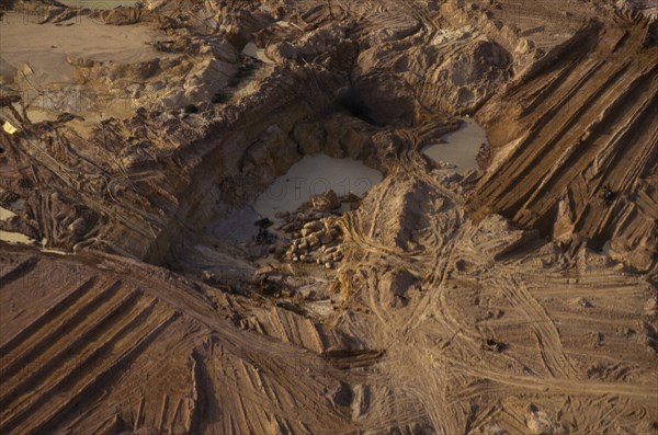 BRAZIL, Mato Grosso, Peixoto de Azevedo, "A garimpo gold mine on former Panara territory, showing garimpeiro gold workings,deforestation and serious pollution of whole environment"