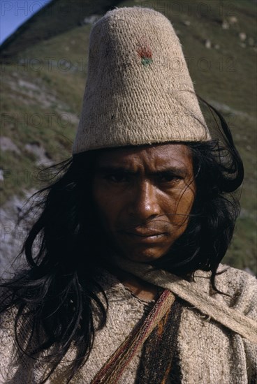 COLOMBIA, Sierra Nevada de Santa Marta, Ika, Portrait of Ika man in traditional dress.Helmet made from woven fique cactus fibre  manta cloak from woven wool&cotton  Arhuaco Aruaco indigenous tribe American Classic Classical Colombian Colombia Hispanic Historical Indegent Latin America Latino Male Men Guy Older South America  Arhuaco Aruaco indigenous tribe American Classic Classical Colombian Columbia Hispanic Historical Indegent Latin America Latino Male Men Guy Older South America History Male Man Guy One individual Solo Lone Solitary 1 Fiber Single unitary