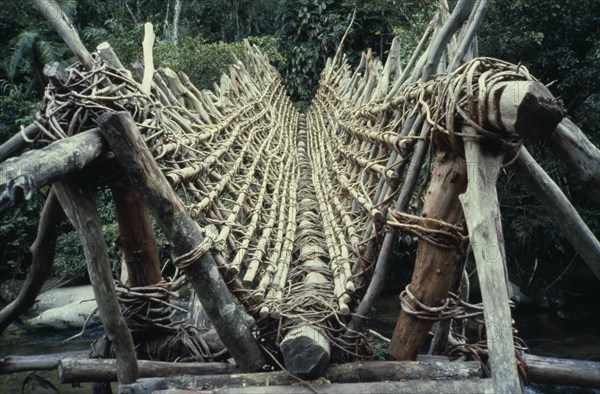 COLOMBIA, Sierra Nevada de Santa Marta, Ika, Ika bridge made from timbers lashed together with vines  v-shaped to allow loaded mules and oxen to cross. Arhuaco Aruaco indigenous tribe American Colombian Colombia Hispanic C39 Indegent Latin America Latino South America  Arhuaco Aruaco indigenous tribe American Colombian Columbia Hispanic Indegent Latin America Latino South America