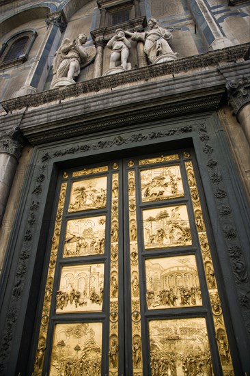 ITALY, Tuscany, Florence, "The 15th Century East Doors of the Baptistry of the Cathedral of Santa Maria del Fiore, the Duomo. The panels are by the artist Lorenzo Ghilberti, and were dubbrd the Gate Of Paradise by Michelangelo"