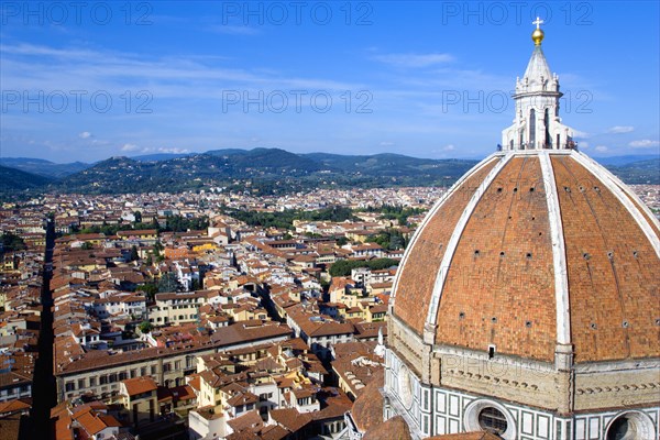 ITALY, Tuscany, Florence, "The Dome of the Cathedral of Santa Maria del Fiore, the Duomo, by Brunelleschi with tourists on the viewing platform looking over the city towards the surrounding hills"