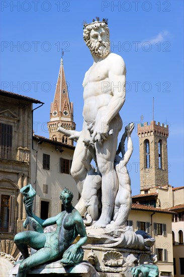 ITALY, Tuscany, Florence, "The 1575 Mannerist Neptune fountain, with the Roman sea God surrounded by water nymphs commemorating Tuscan naval victories, by Ammannatti in the Piazza della Signoria beside the Palazzo Vecchio"