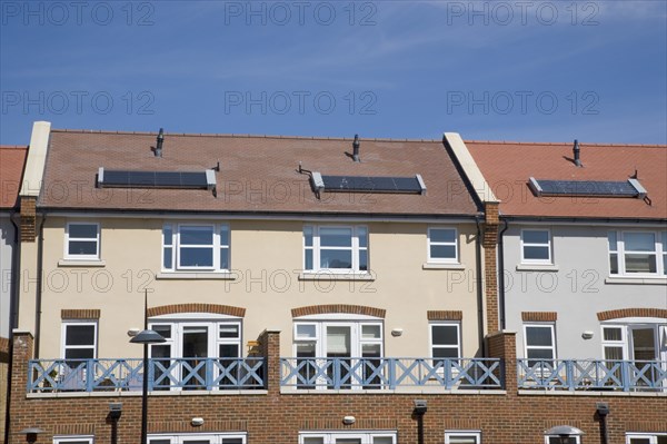 ENGLAND, West Sussex, Shoreham-by-Sea, Ropetackle housing development on the banks of the river Adur. A regenerated brownfield former industrial area. Solar heating panels visible in the rooftops.