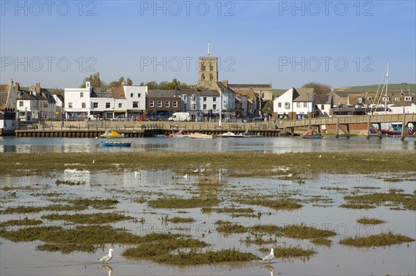 ENGLAND, West Sussex, Shoreham-by-Sea, View across the river Adur mud flats toward the won centre.
