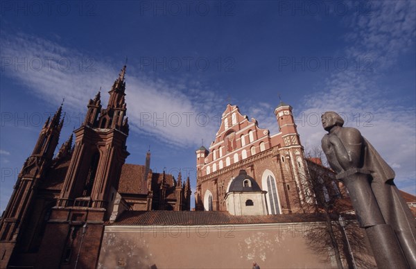 LITHUANIA, Vilnius, Saint Francis and Bernardine Church behind the Adam Mickiewicz statue