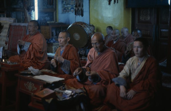 MONGOLIA, Ulan Bator, Buddhist monks in Ulan Bator's only temple allowed by the authorities in 1974. They chant and pray in low lit temple interior in trance like state. Ulaanbaatar East Asia Asian Baator Mongol Uls Mongolian Religion Religion Religious Buddhism Buddhists Ulaan