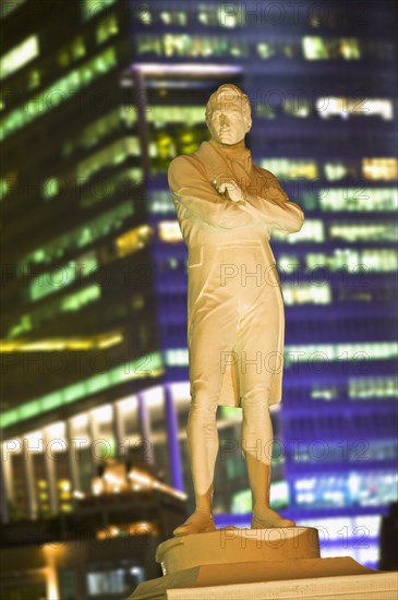 SINGAPORE, Raffles, Statue of Sir Stamford Raffles illuminated at night.