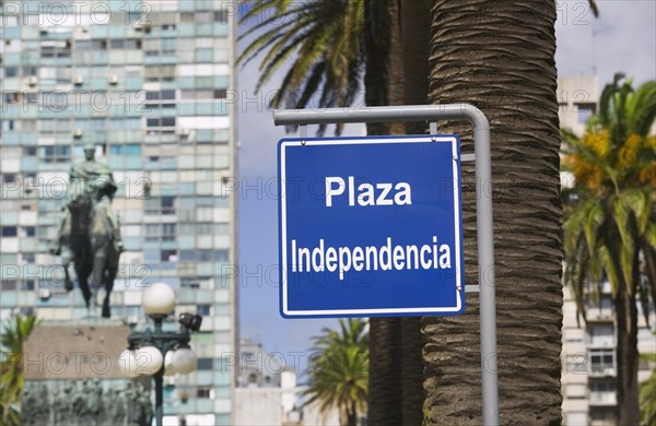 URUGUAY, Montevideo, Plaza Independencia sign with statue of Jose G Artigas in the background.