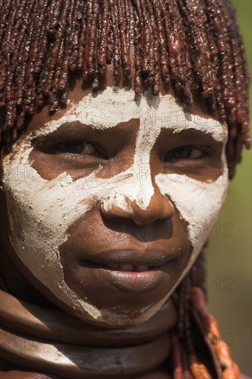 ETHIOPIA, Omo Valley, Mago National Park, "Banna woman, her hair greased with ocher colouring and animal fat into plaits known as Goscha "
