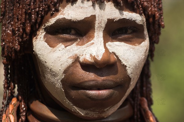 ETHIOPIA, Omo Valley, Mago National Park, "Banna woman, her hair greased with ocher colouring and animal fat into plaits known as Goscha  Jane Sweeney "