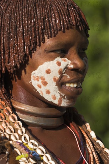 ETHIOPIA, Lower Omo Valley, Mago National Park, "Woman with face painting, her hair greased with ocher colouring and animal fat into plaits known as Goscha."