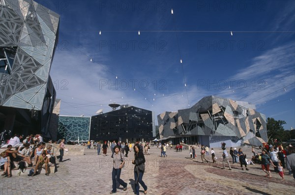 AUSTRALIA, Victoria, Melbourne, "Federation Square.  Public civic centre and meeting place, modern architecture and crowds of people."