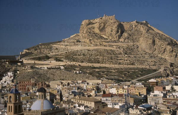 SPAIN, Pais Valenciano, Costa Blanca, "Alicante.  Castle on top of steep, rocky hillside with city spread out below."