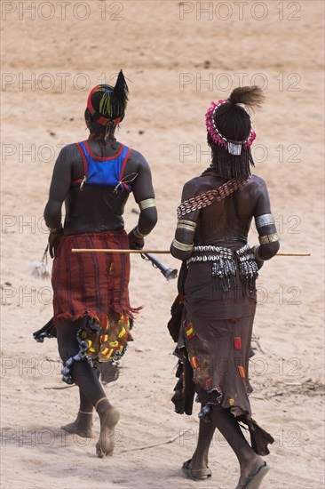 ETHIOPIA, Lower Omo Valley, Turmi, "Hamer Jumping of the Bulls initiation ceremony, Women sing and dance before the bull jumping Jane Sweeney "