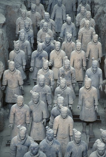 CHINA, Shaanxi, Xian, Soldier figures from the terracotta army created to guard the tomb of Emperor Shi Huangdi and dating from the 3rd century B.C.
