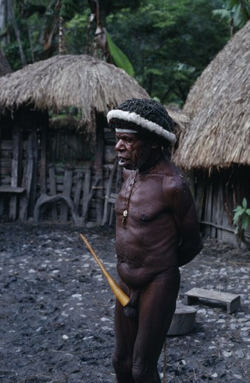 INDONESIA, Irian Jaya, Baliem  Valley, "Old male Dani warrior wearing penis gourd and luck charms.  Irian Jaya was annexed by Indonesia in 1963 and seeks independence, its situation remains unclear."