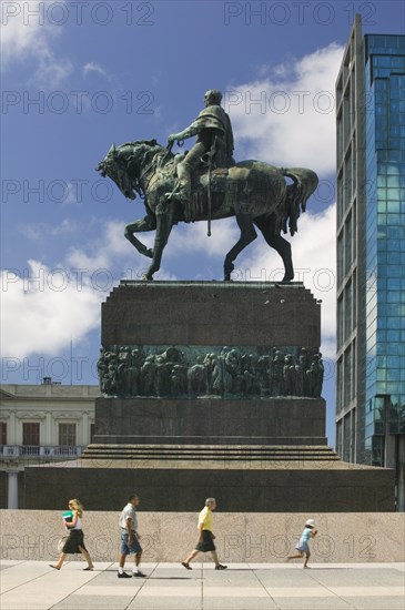 URUGUAY, Montevideo, Statue of Jose G Artigas that stands on top of his mausoleum in Plaza Independencia. Jon Hicks.