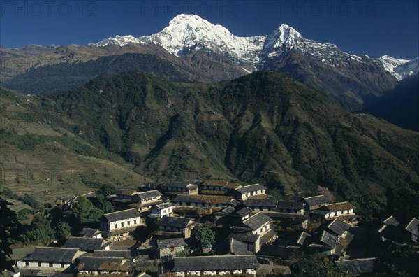 NEPAL, Annapurna Region, Ghandruk, Sanctuary Trek. Ghandruk Village with mountains Annapurna South and Hiunchuli in the background
