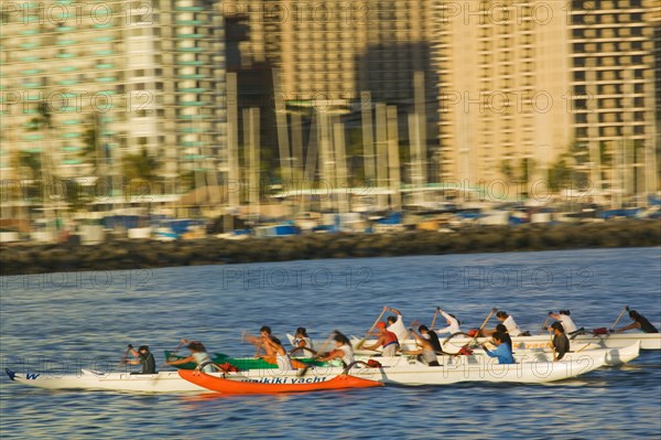 USA, Hawaii, Oahu, Honolulu. Outrigger canoeists training in Ala Wai Yacht Harbour.