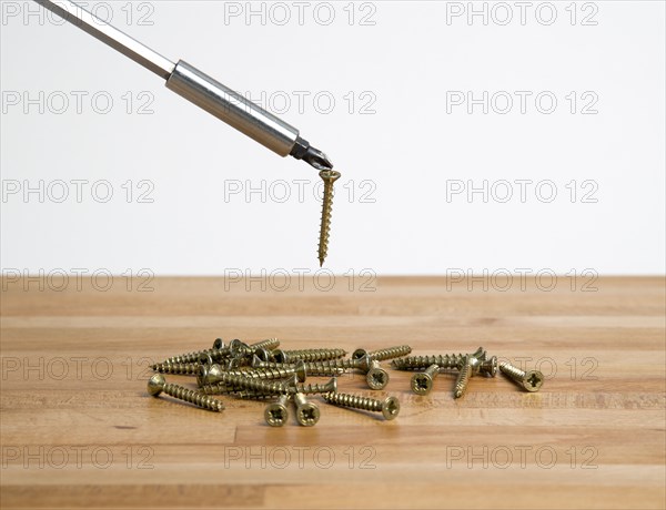 INDUSTRY, Work, Tools, Magnetic Philips head screwdriver picking up self tapping screws.