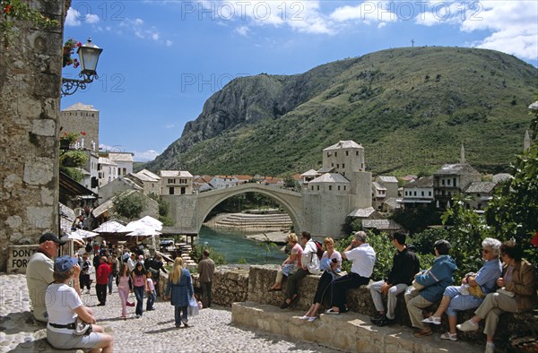 BOSNIA HERZEGOVINA, Mostar, "Stari Most, Old Bridge, following reconstruction, tourists, and Neretva River. Former Yugoslavia"