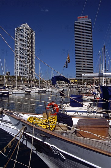 SPAIN, Catalonia, Barcelona, "Port Olimpic, Bow of yacht, marina, Hotel Arts and Torre Mapfre"