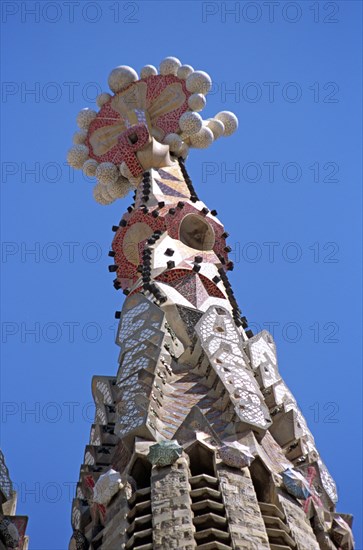 SPAIN, Catalonia, Barcelona, La Sagrada Familia colourful cathedral steeple detail.