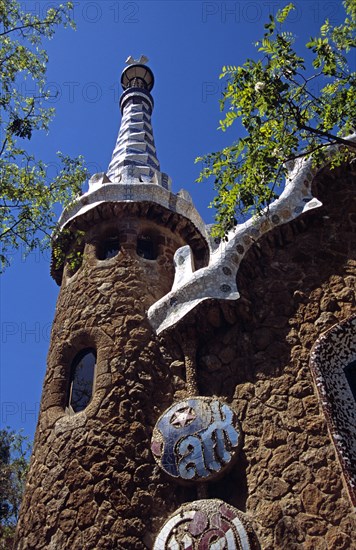 SPAIN, Catalonia, Barcelona, Guell Park sign on building at entrance to Park Guell