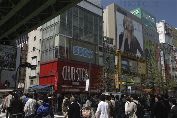 JAPAN, Honshu, Tokyo, "Akihabara - huge billboard of Cameron Diaz advertising SoftBank cell phones, shoppers crossing Chuo-dori"