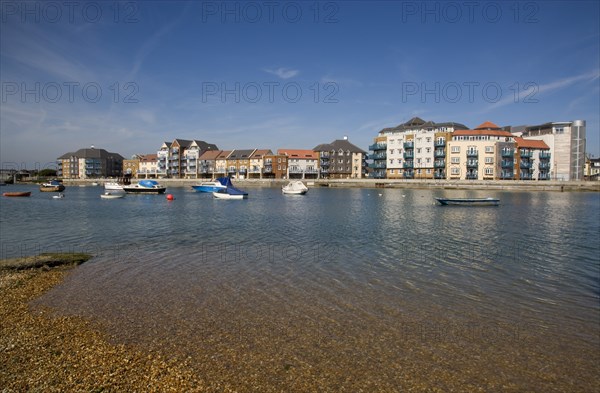 ENGLAND, West Sussex, Shoreham-by-Sea, Ropetackle modern housing development apartments on the banks of the river Adur seen from the opposite bank.. A regenerated brownfield former industrial area.