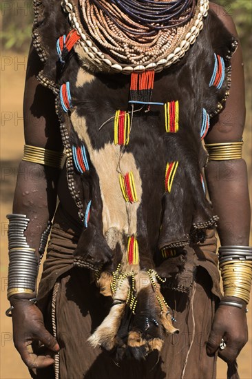 ETHIOPIA, Omo Valley, Mago National Park, Womans necklaces and traditional goatskin dress decorated with cowrie shells  Jane Sweeney