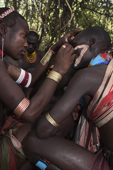 ETHIOPIA, Lower Omo Valley, Turmi, "Hama Jumping of the Bulls initiation ceremony, Face painting with a mixture of clay, oils and plant pigment"