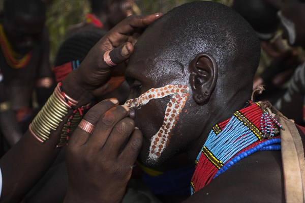 ETHIOPIA, Lower Omo Valley, Turmi, "Hama Jumping of the Bulls initiation ceremony, Face painting with a mixture of clay, oils and plant pigment"