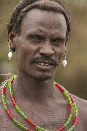 ETHIOPIA, Lower Omo Valley, Village near Omorate, Dassanech man