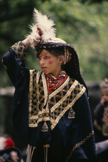 PAKISTAN, North West Frontier, Bumburet, Young Kalash girl wearing traditional dress at the Chilimjusht Festival in Bumburet