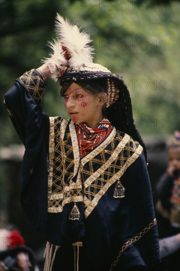 PAKISTAN, North West Frontier, Bumburet, Young Kalash girl wearing traditional dress at the Chilimjusht Festival in Bumburet