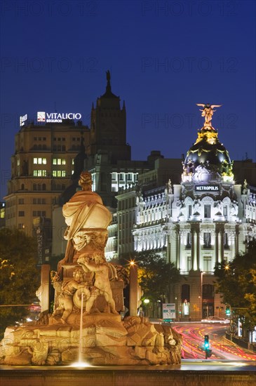 SPAIN, Madrid, The fountain in Plaza Cibeles at dusk.