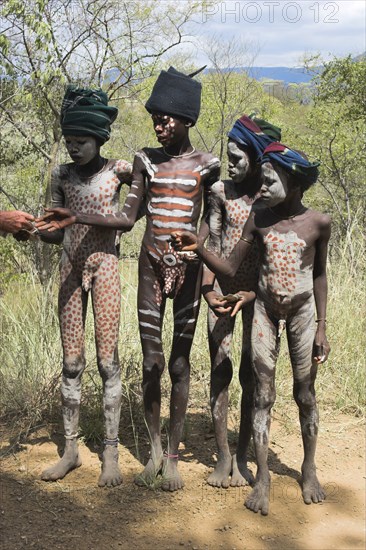 ETHIOPIA, South Omo Valley, Mursi Tribe, Young boys with body painting