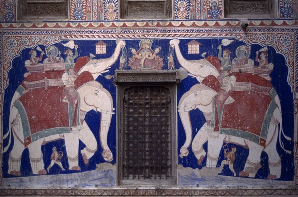 INDIA, Rajasthan, Fatehpur, Wall painting of Lakshmi with attendant elephants inside the Nand Lal Devra Haveli