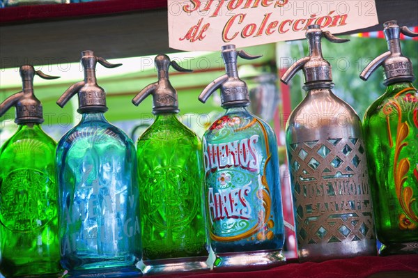 ARGENTINA, Buenos Aires, Soda syphons for sale in the San Telmo flea market in Plaza Dorrego