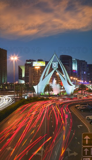 UAE, Dubai, The Clock Tower roundabout in Rigga at dusk.