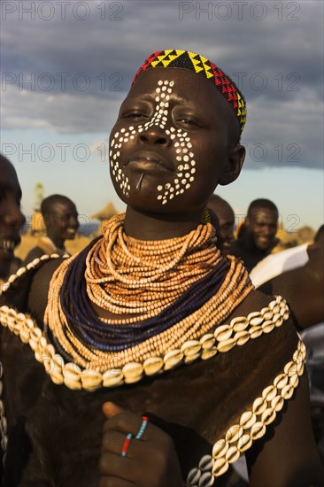 ETHIOPIA, Lower Omo Valley, Kolcho, Karo people with body painting (made from mixing animal pigments with clay) dancing