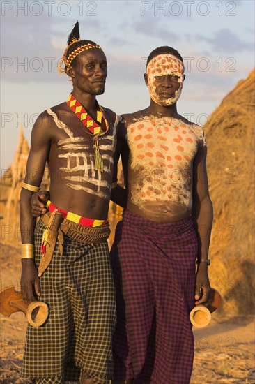 ETHIOPIA, Lower Omo Valley, Kolcho, Karo men with body painting (made from mixing animal pigments with clay)