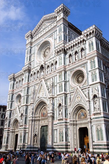 ITALY, Tuscany, Florence, "Tourists in front of the Neo-Gothic marble west facade of the Cathedral of Santa Maria del Fiore, the Duomo"