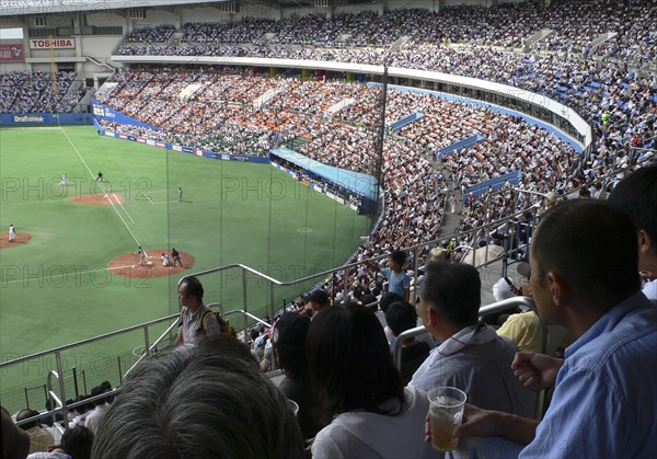 JAPAN, Honshu, Tokyo, "Chiba Marine Stadium, packed crowd watches Chiba Lotte marines play Nippon Ham Fighters, Japanese Pro basebal"